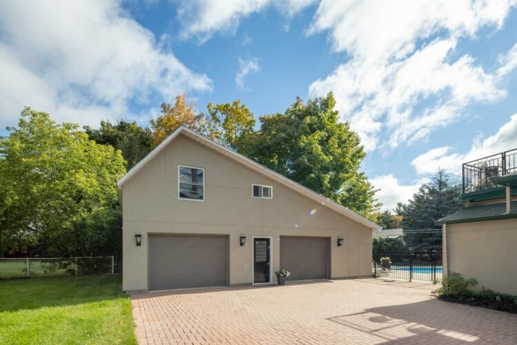 Front view of a large family home with a driveway